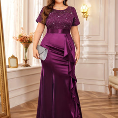 A plus size purple floor-length dress with a sequined lace bodice and a ruffled mermaid hem.