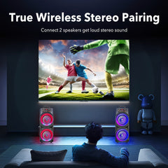 Two portable dual-speaker towers with glowing RGB lights placed on either side of a television.