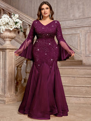 A plus-size purple V-neck gown featuring sequined lace, long bell sleeves, and a mermaid tulle hem.