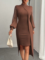 A brown midi dress with a high neck, sheer sleeves adorned with pearls, and an overlay panel.