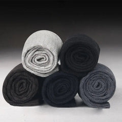 Ten pairs of men's bamboo fiber socks in black, size 42-45, are stacked in a pyramid shape. They feature compression support and are suitable for business or casual wear, perfect as an autumn gift.