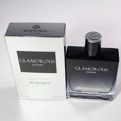 A 100ML OEM/ODM EDP men’s perfume with long-lasting fragrance comes in black and white packaging with silver accents, and the bottle has a decorative silver cap.