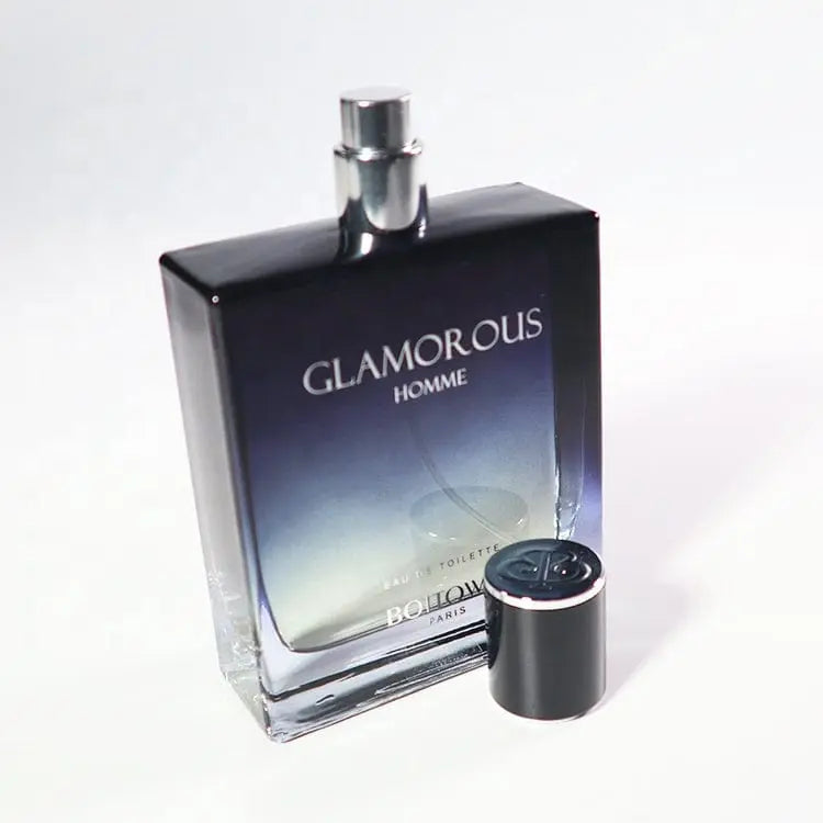 A rectangular 100ML OEM/ODM EDP men perfume bottle with a black gradient design is shown on a white background, its cap removed and placed beside it, highlighting the long lasting fragrance inside.