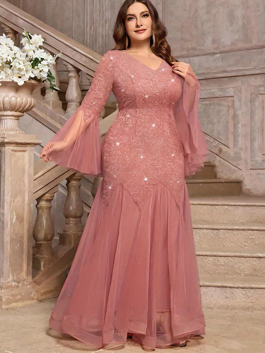 A dusty pink plus-size formal gown featuring a sequin lace bodice, V-neck, and flared tulle hem.
