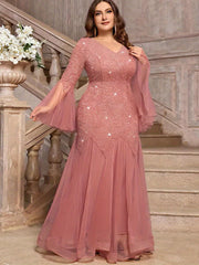 A dusty pink plus-size formal gown featuring a sequin lace bodice, V-neck, and flared tulle hem.