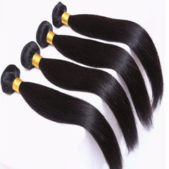 Four bundles of straight black Peruvian human hair extensions with gold-colored ties.