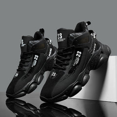 A pair of black mid-top men's running shoes with lace-up closures and the number 23 printed on them.
