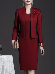 A wine red two-piece set featuring a long-sleeve jacket and a sleeveless sheath dress.