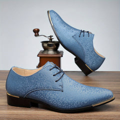 A pair of blue glittery lace-up oxford shoes with black soles and gold-tone accents.
