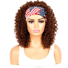 A medium-length kinky curly brown wig styled with an American flag patterned headband.