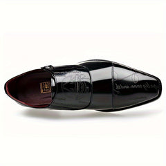 A black patent leather men's dress shoe with a buckle closure and decorative etched patterns.