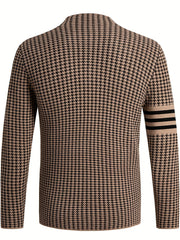 A tan and black houndstooth knit cardigan with a stand collar and striped sleeve detail.