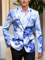 A man wears a skinny-fit blazer featuring a blue and white cloud-like gradient print.