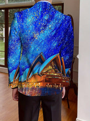 A man wears a single-breasted blazer featuring a vibrant print of the Sydney Opera House at night.