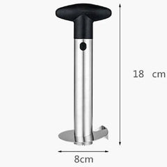 A stainless steel pineapple slicer with a black T-shaped handle, measuring 18 cm by 8 cm.