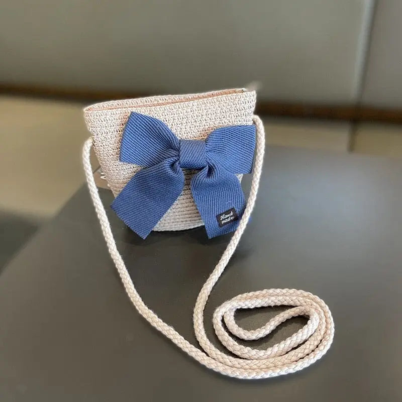 A beige woven crossbody bag with a blue bow pairs perfectly with the 2-8 Years Kids Sun Hat Girls Summer New Straw Bag Cap Set for a cute, sun-safe look—ideal for beach trips or outdoor adventures.