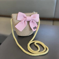 The 2-8 Years Kids Sun Hat Girls Summer Straw Bag Cap Set features a woven straw crossbody bag with a yellow strap and pink bow, paired with a matching fitted sun hat—perfect for beach or travel sun protection.
