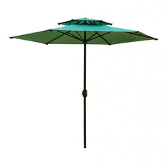 A green outdoor patio umbrella with a two-tier canopy and a black pole.