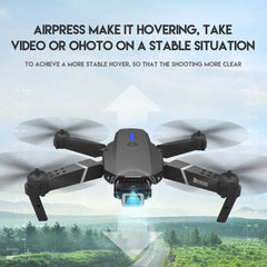 The 2022 E88Pro RC Drone features a 4K professional wide-angle HD camera and stable hovering, perfect for capturing stunning aerial views of trees and hills with its foldable design and WIFI FPV.