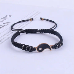 A black adjustable cord bracelet with a gold-edged black yin yang pendant and black beads, shown on a white background; perfect as 2022 New Best Friend Bracelets for 2, matching BFF friendship or relationship jewelry.
