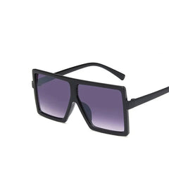 Oversized square children's sunglasses with black plastic frames and purple gradient lenses.