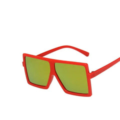 Children's square sunglasses with a red plastic frame and reflective green lenses.