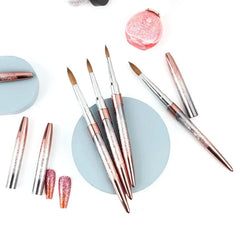 Kolinsky sable acrylic nail brushes with decorative metal handles and lids.