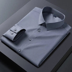 A folded long-sleeve grey dress shirt with a turn-down collar and button-up front.