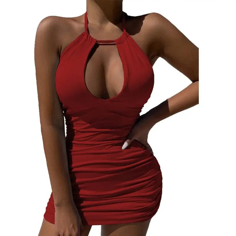 A woman models the 2023 Summer Party Dress—an elegant, sexy red bodycon mini with a halter neckline and front hollow cutout—posing with one hand on her hip against a plain white background.