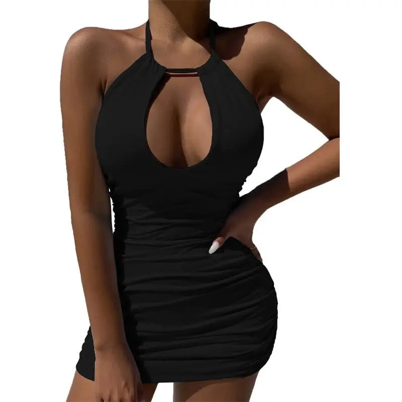 A woman poses with one hand on her hip in a 2023 Summer Party Dress—an elegant, sexy bodycon mini with a fitted halter neck and hollow cutout, showcasing the dress's slim fit design against a plain white background.