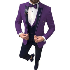 A man wears a purple three-piece suit with a dark vest, bow tie, and matching trousers.