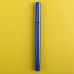A sleek blue eyeliner pen is centered vertically against a solid yellow background.