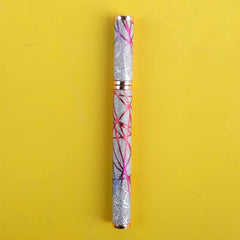 A silver glitter eyeliner pen with a geometric pattern of pink and blue lines.