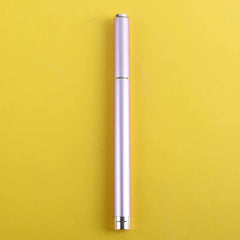 A sleek, light pink eyeliner pen with gold accents stands vertically against a yellow background.