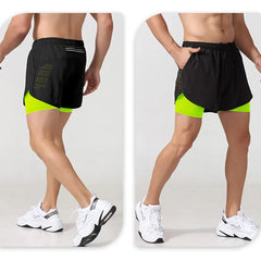A man wears black two-in-one athletic shorts with a neon yellow compression liner.