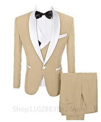 A three-piece tan men's suit featuring a shawl lapel blazer, a vest, and matching trousers.