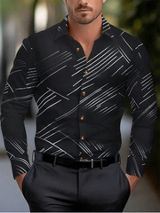 A man wears a black long-sleeved button-down shirt featuring a white abstract diagonal line pattern.