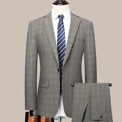 A grey checkered two-piece suit for men featuring a single-breasted blazer and matching trousers.