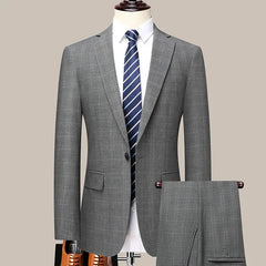 A grey checkered two-piece suit for men featuring a single-breasted blazer and matching trousers.