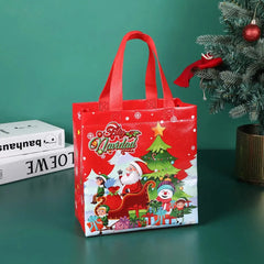 A red non-woven Christmas gift bag featuring a cartoon Santa, snowman, and elf design.