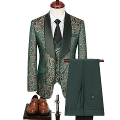 A three-piece men's suit featuring a green and gold jacquard blazer, matching vest, and solid green trousers.