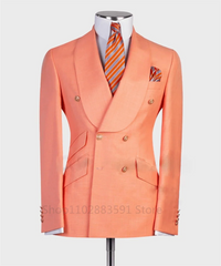 A peach-colored double-breasted blazer with a wide shawl lapel and gold buttons.