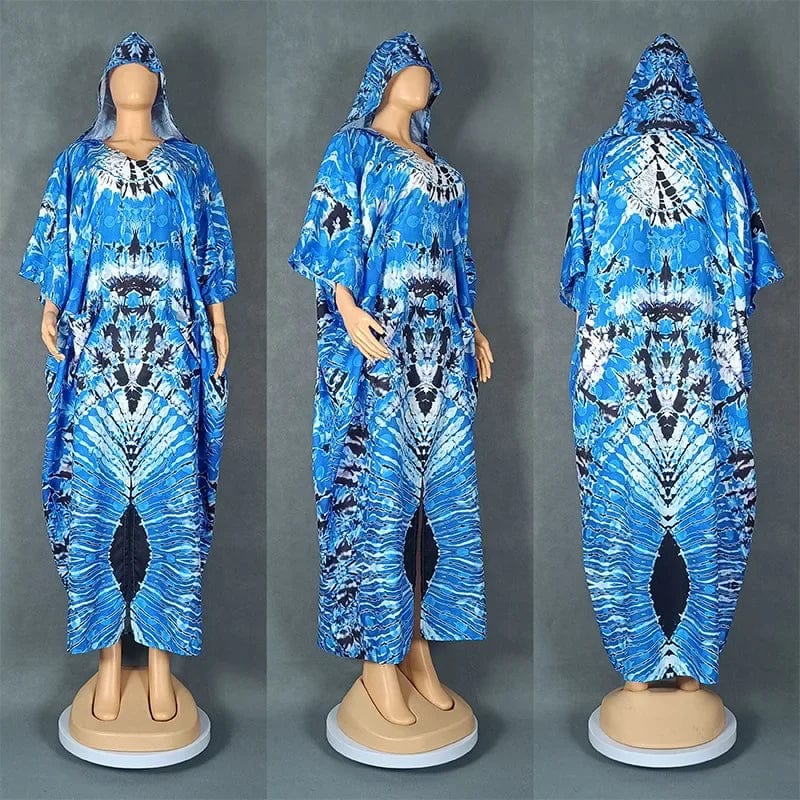 A blue and white tie-dye hooded kaftan dress with a loose, flowing silhouette.