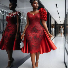 A knee-length red lace dress with a ruffled shoulder detail and a satin overskirt.