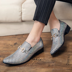 A pair of men's slip-on loafers featuring a metallic, iridescent fish-scale pattern and gold-tone hardware.