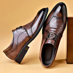 A pair of brown patent leather loafers with a pointed toe and a metallic G-shaped buckle.
