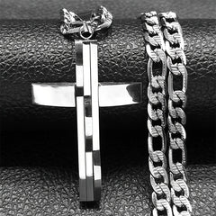A silver-toned stainless steel cross pendant hangs from a matching thick curb chain.