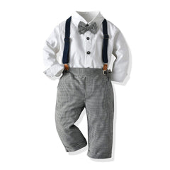 A toddler suit featuring a white long-sleeve shirt, gingham pants with suspenders, and a bow tie.