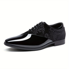 A black men's dress shoe featuring a glossy patent leather toe and a patterned velvet upper.