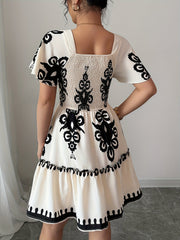 Elegant Mini Dress with a Square Neckline, Featuring Fashionable Prints, Pleats, a Cinched Waist for a Slimming Effect, And Ruffled Edges with an A-Line Hem.